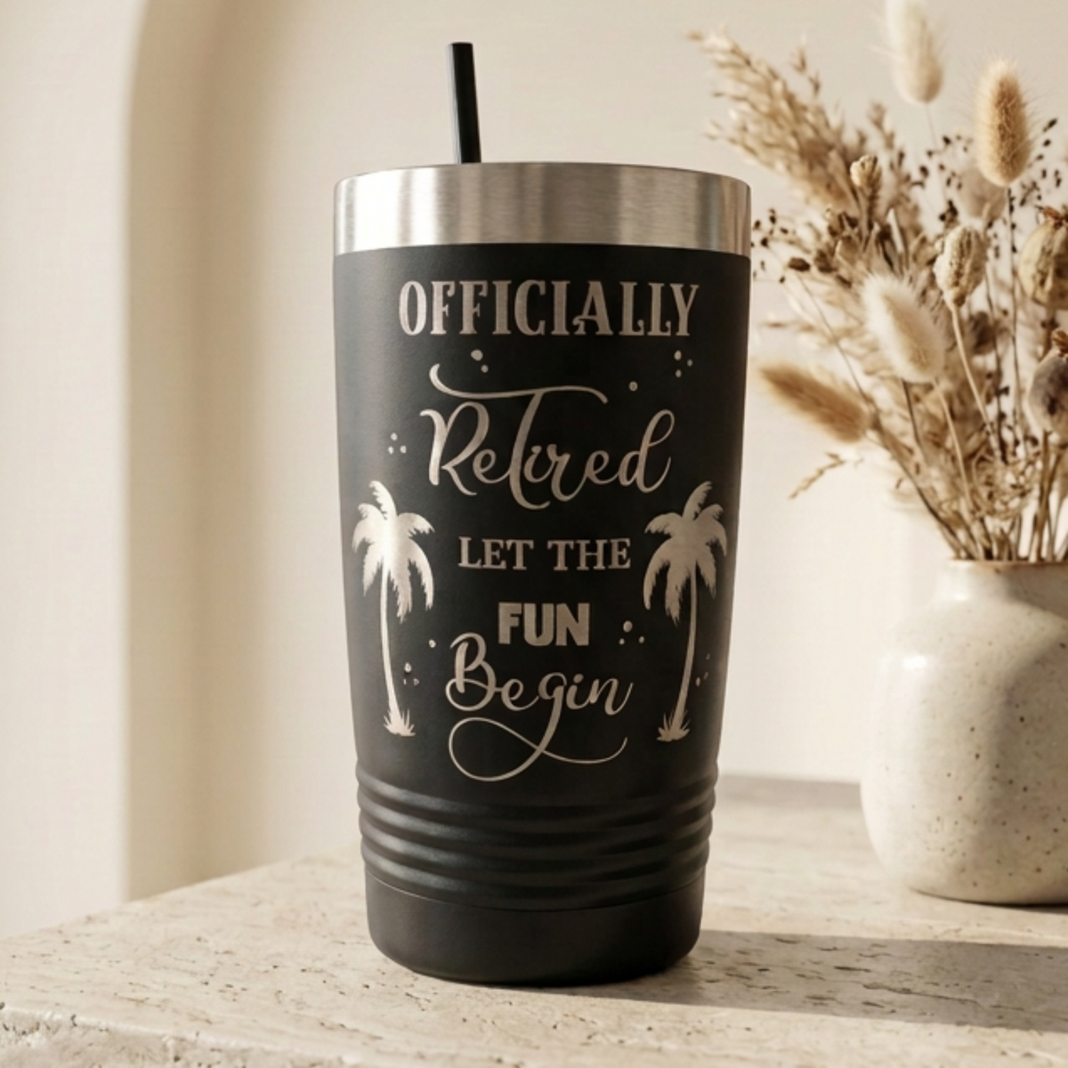 Black 20 oz Officially Retired tumbler laser engraved with palm trees and Let the Fun Begin