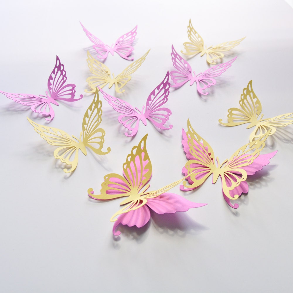 Pink butterfly wall stickers arranged on a white background, showing the 18-piece cardstock set.