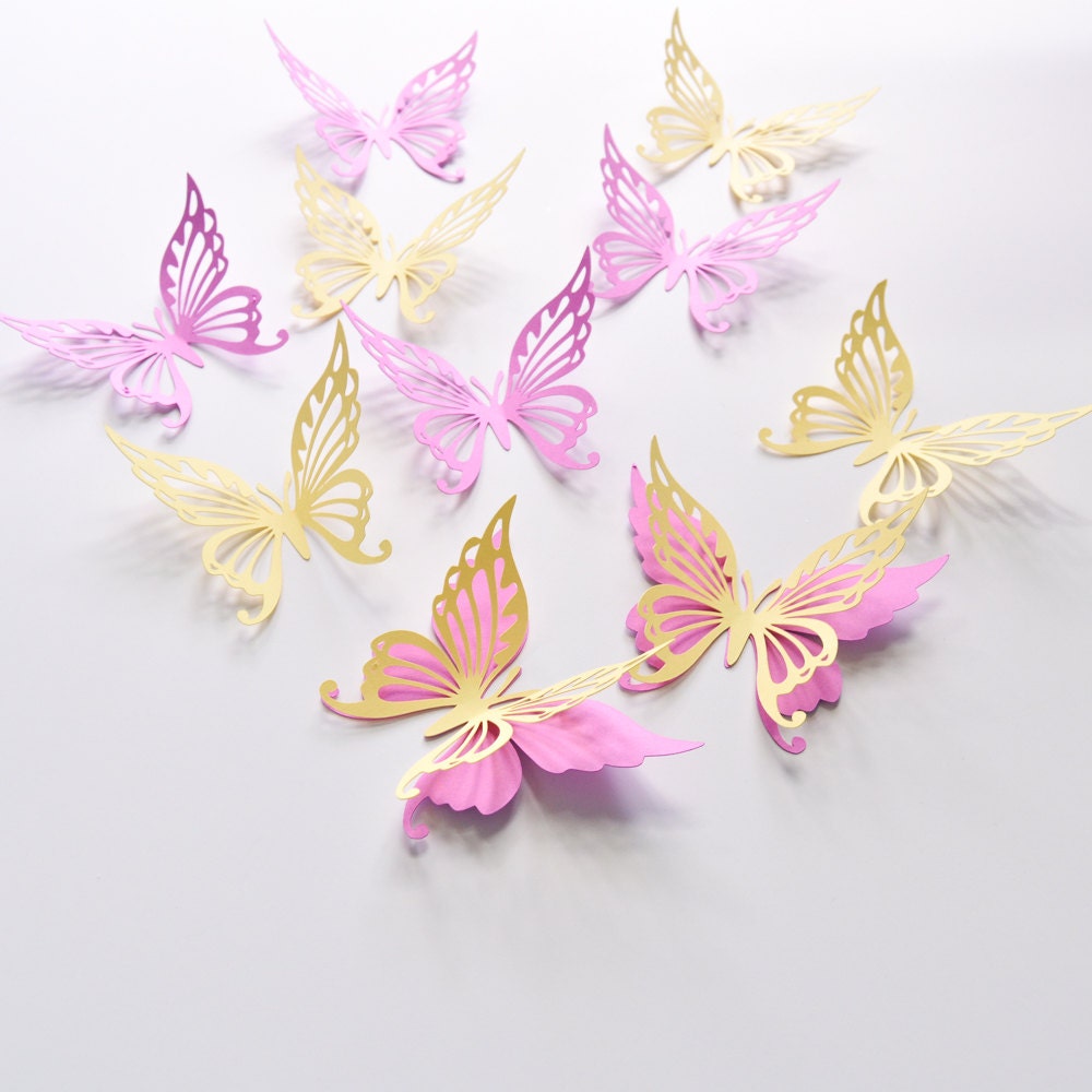 Close-up of butterfly wall stickers in orchid and light yellow tones with delicate paper texture.